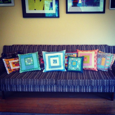 a whole bunch of log cabin pillows